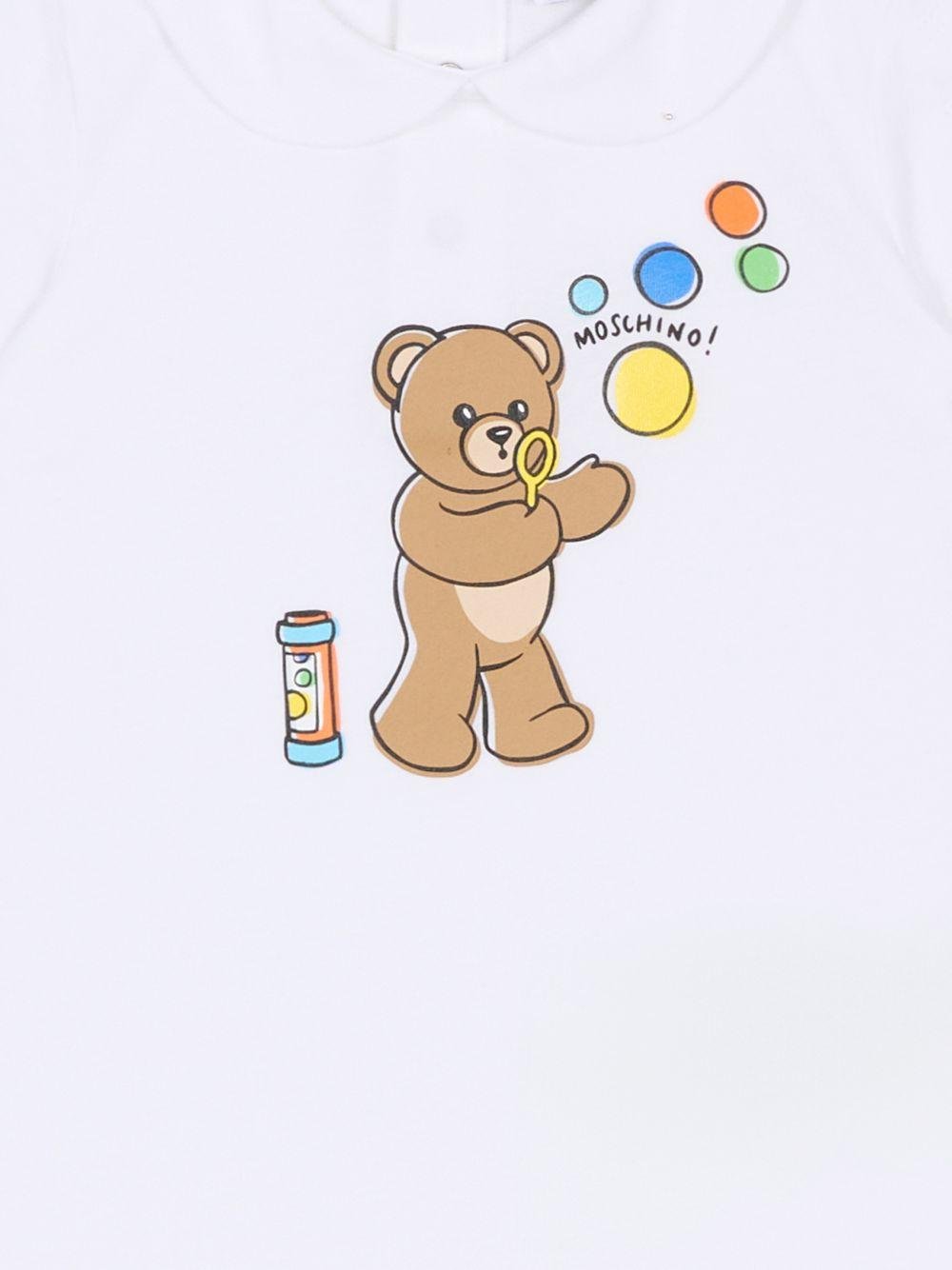 Tutina per neonati Moschino Kids bianca con stampa grafica Orsetto con bolle di sapone - Rubino Kids