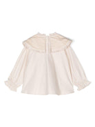 Blusa per bambina Donsje Mellys beige con dettagli ruches e colletto con pettorina - Rubino Kids