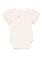 Body per neonata Donsje Nowie beige con motivo con ricamo - Rubino Kids