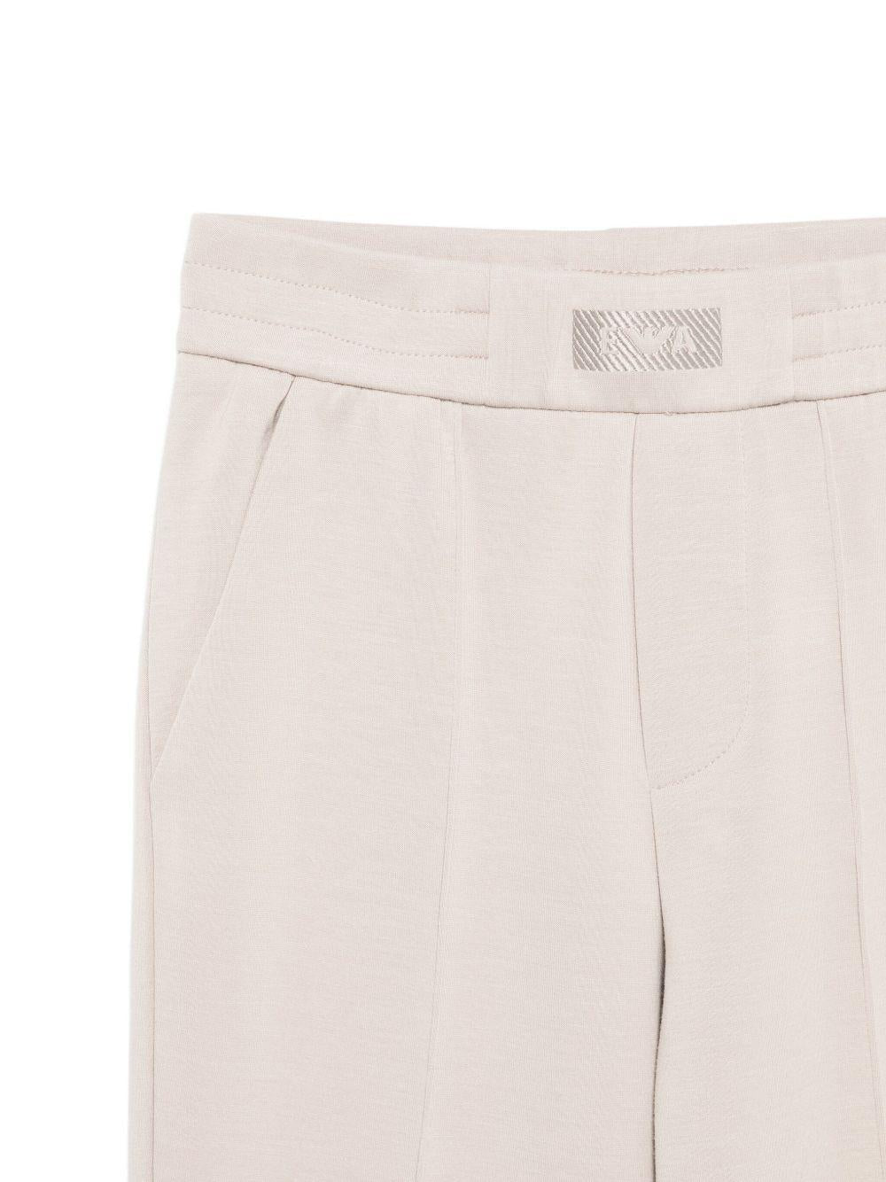 Completo tuta sportiva per bambino Emporio Armani Kids beige con etichetta con logo - Rubino Kids