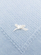 Coperta per neonato Paz Rodríguez azzurra con fiocco in raso - Rubino Kids