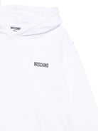 Felpa per bambina Moschino Kids bianco con cappuccio e strass con faccina sorridente - Rubino Kids