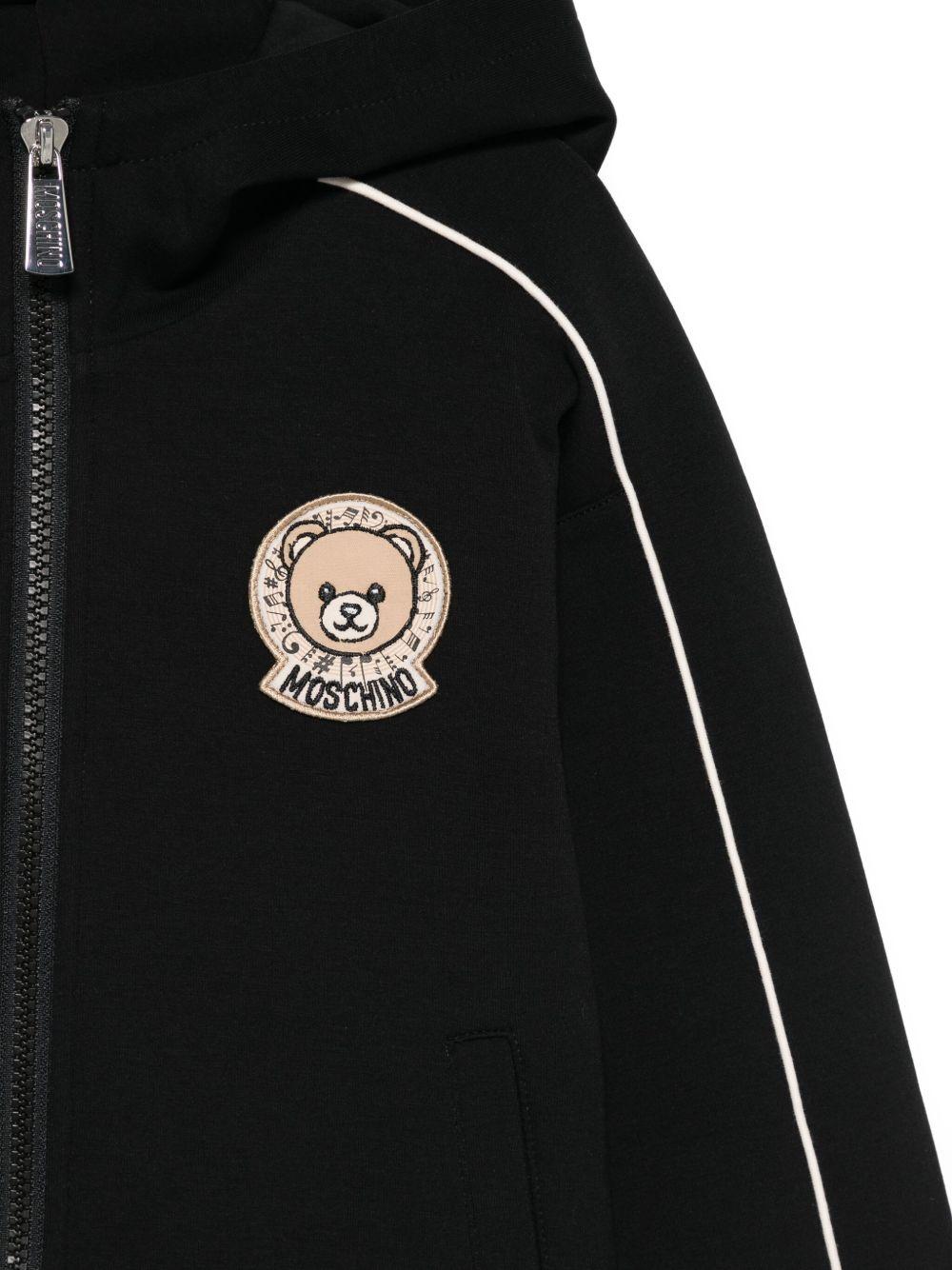 Felpa per bambino Moschino Kids nero con cappuccio e zip con logo teddy - Rubino Kids