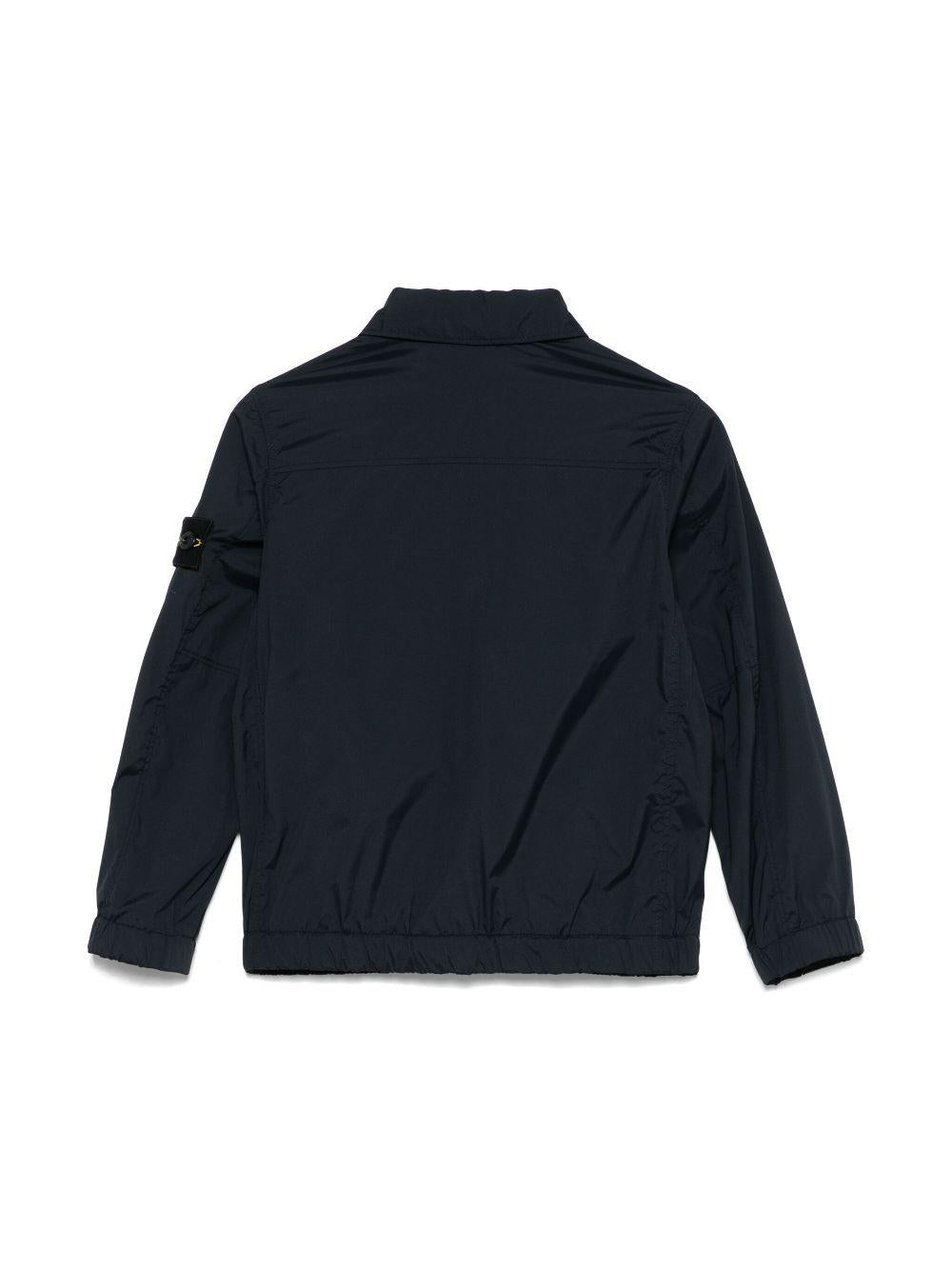 Giubbino con applicazione Compass per bambino Stone Island Junior blu con colletto classico - Rubino Kids