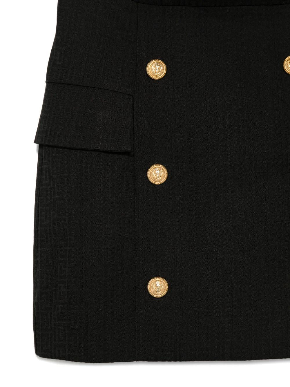 Gonna per bambina Balmain Kids nera con bottoni oro e tasche ad aletta - Rubino Kids