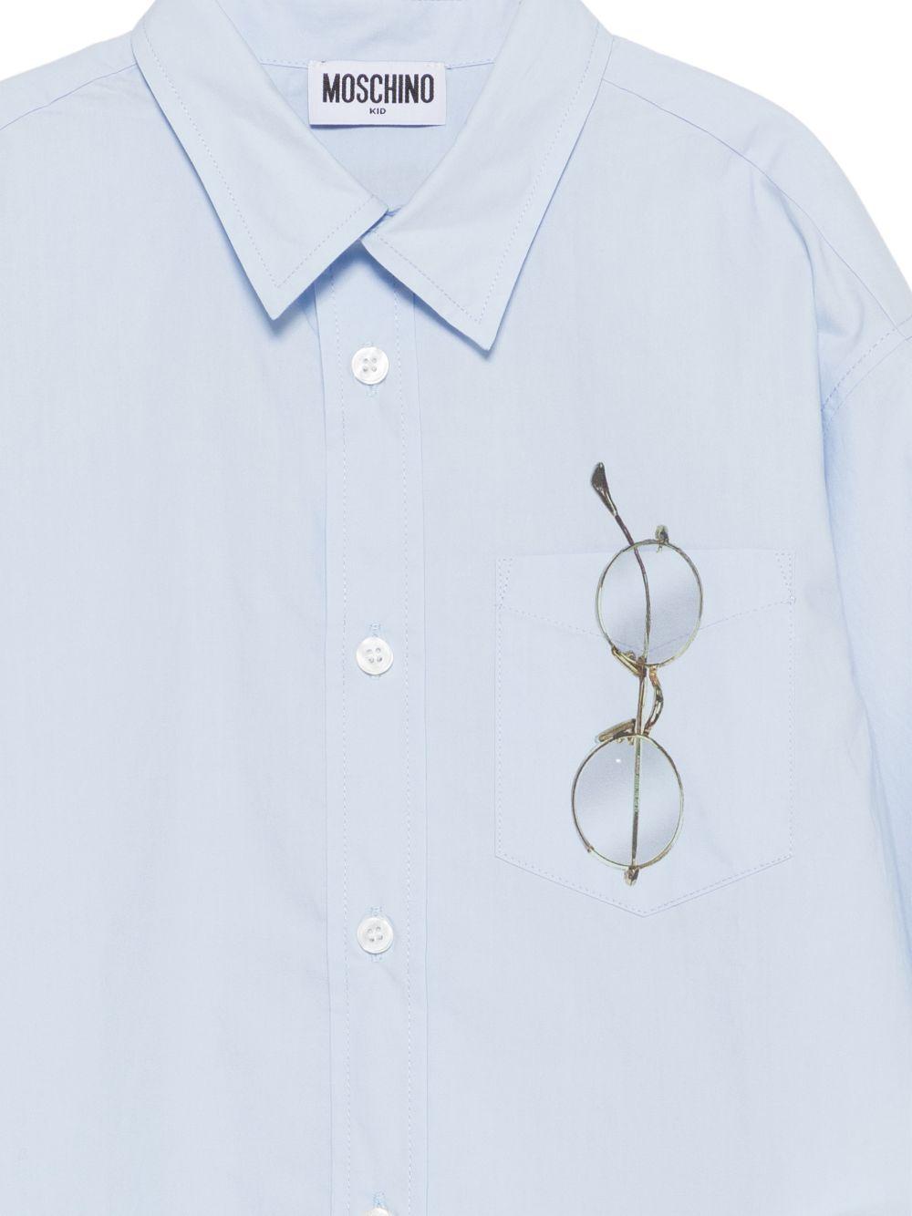 Camicia per bambino Moschino Kids azzurra con stampa grafica occhiali HUC01YLLA10 40213 MOSCHINO KIDS 