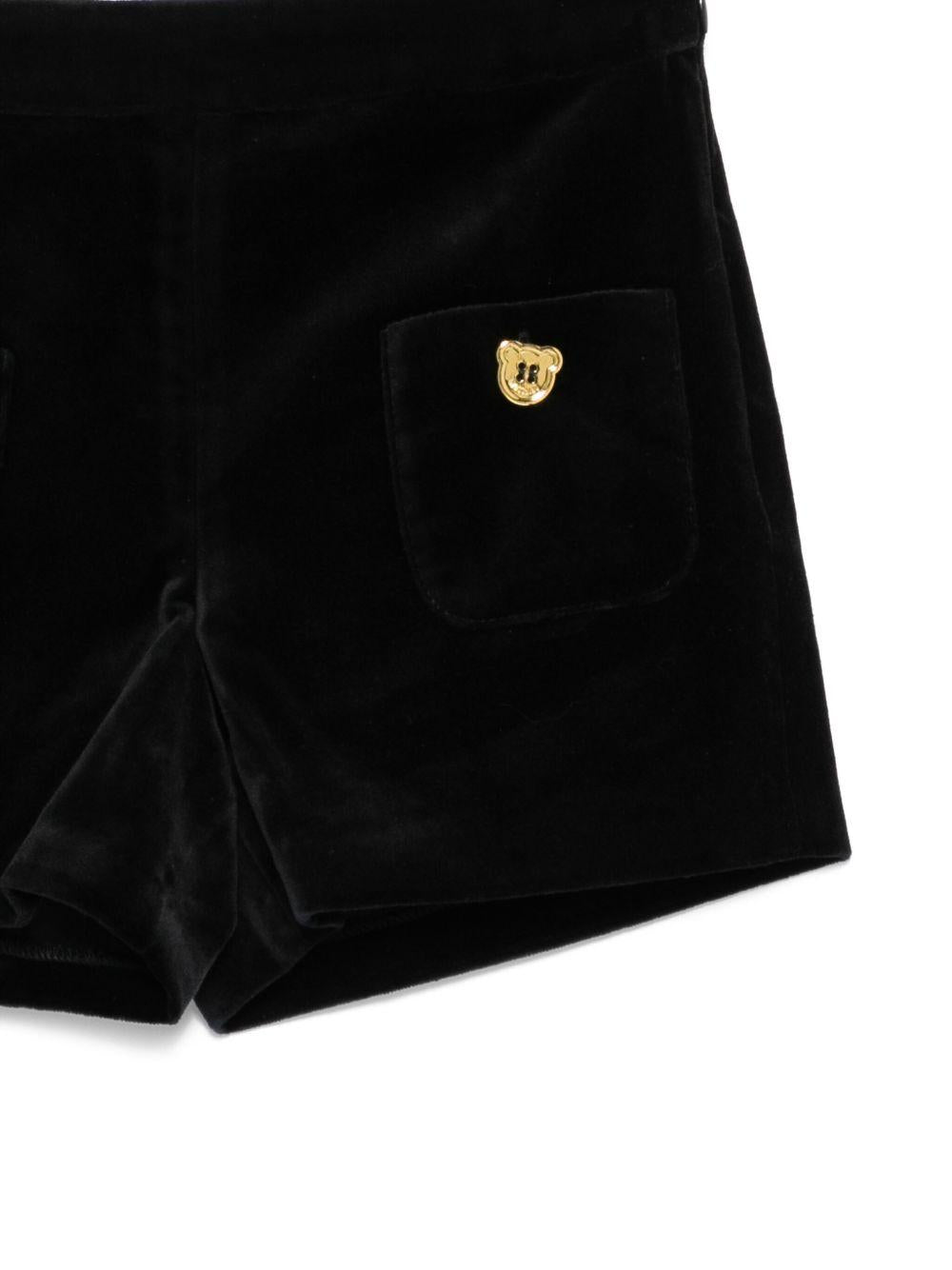Shorts per bambina Moschino Kids nera con bottoni color oro HDQ01VLWA07 60100 MOSCHINO KIDS 