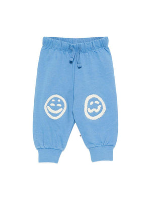 Simeon Molo baby boy's light blue sports trousers with smiley patches on the knees