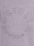 T-shirt per bambina Stella McCartney Kids grigia con logo goffrato sul davanti TV8P41 Z0434 809 STELLA McCARTNEY KIDS 