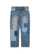 Jeans dritti per bambina Moschino Kids denim con design patchwork - Rubino Kids