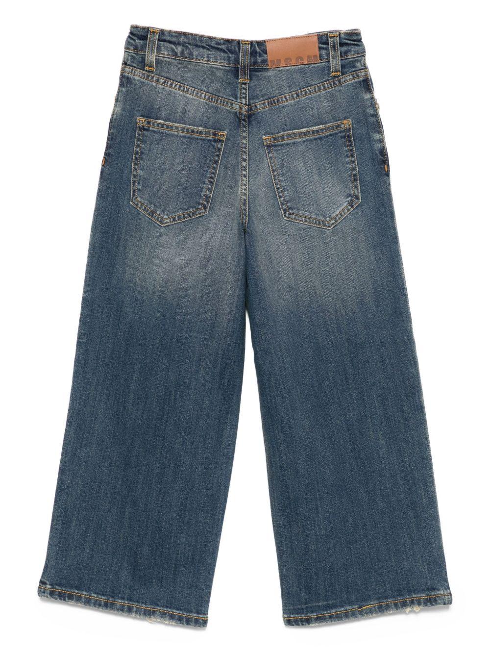 Jeans per bambina MSGm Kids in denim con borchie all - over - Rubino Kids