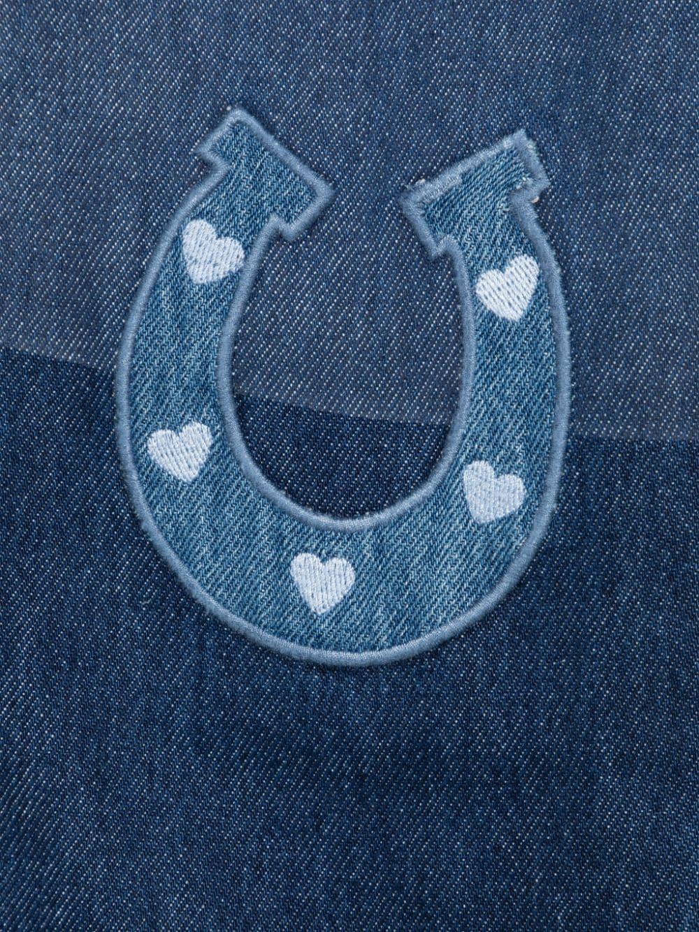 Jeans per bambina Stella McCartney Kids in denim blu con applicazione sul davanti - Rubino Kids