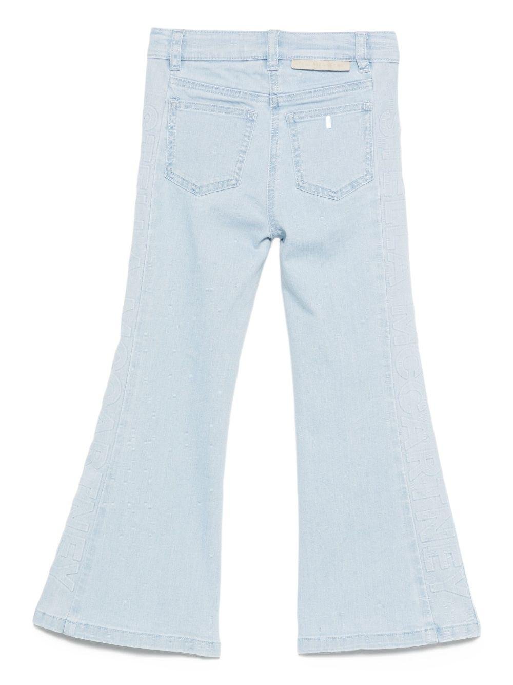 Jeans per bambina Stella McCartney Kids in denim con gamba a zampa - Rubino Kids