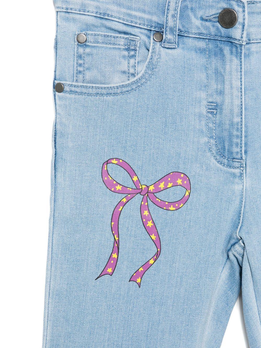 Jeans per bambina Stella McCartney Kids in denim con ricamo fiocco - Rubino Kids