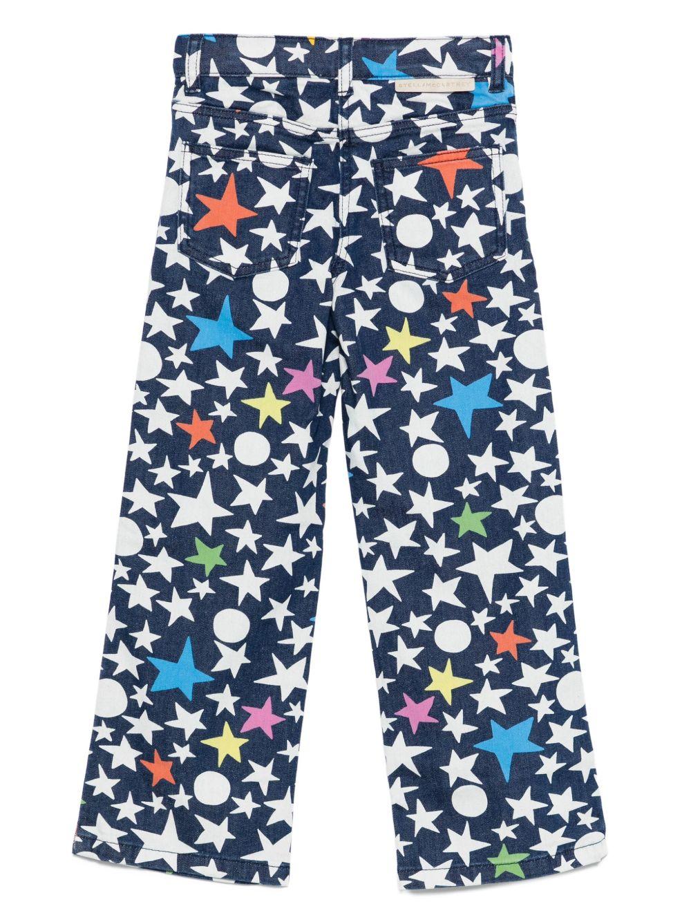 Jeans per bambina Stella McCartney Kids in denim con stelle all - over - Rubino Kids