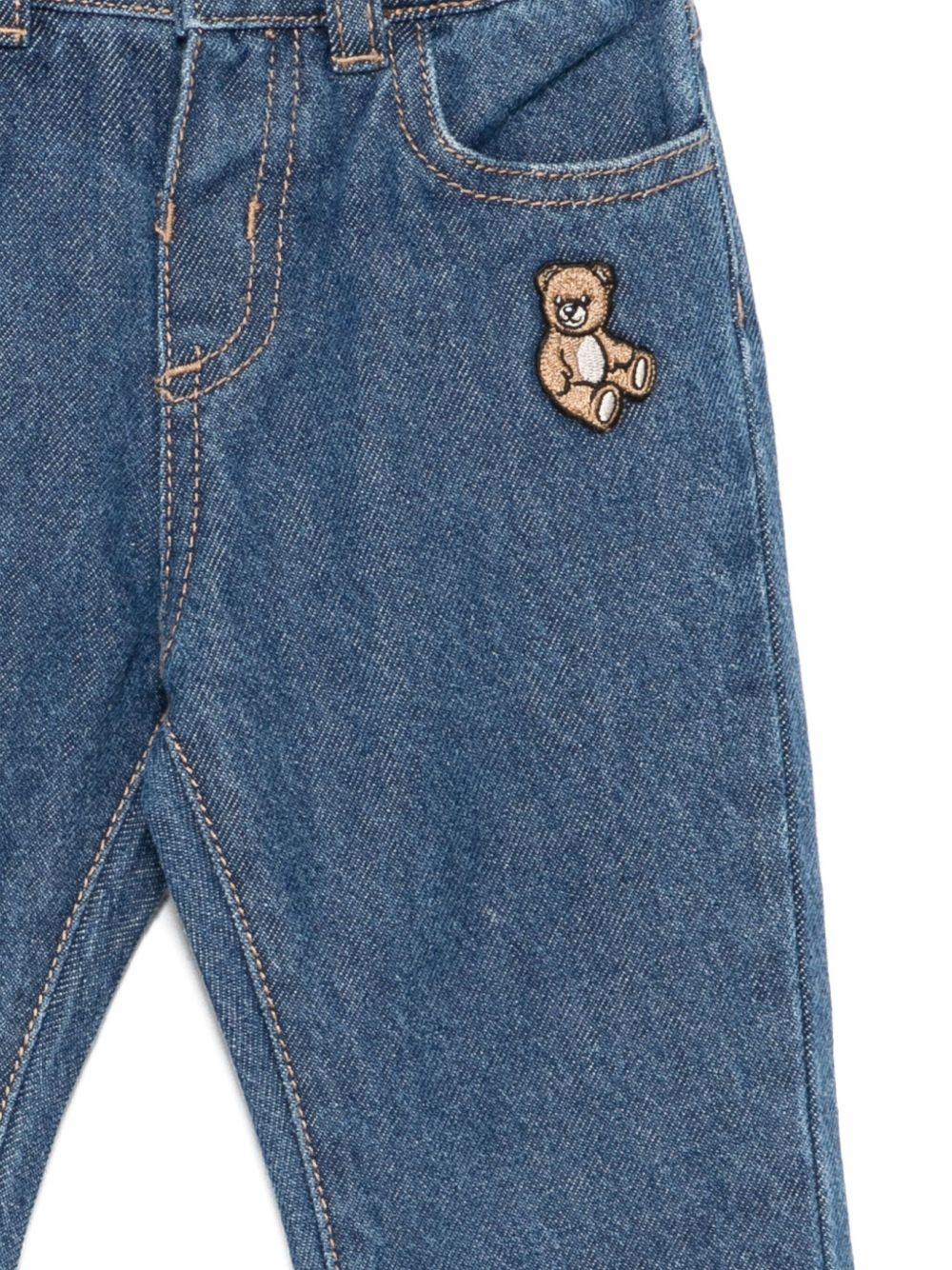 Jeans per neonata Moschino Kids in denim con ricamo orsetto - Rubino Kids