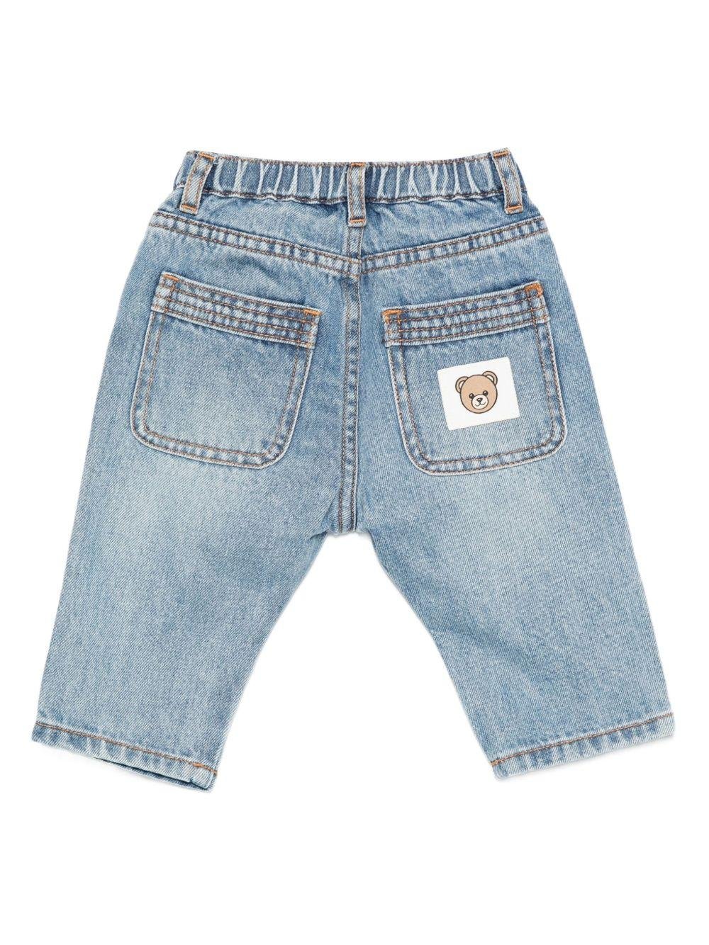 Jeans per neonato Moschino Kids in denim con vita elasticizzata - Rubino Kids