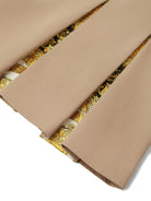 Minigonna plissettata per bambina Versace Kids beige con dettaglio laterale Medusa - Rubino Kids