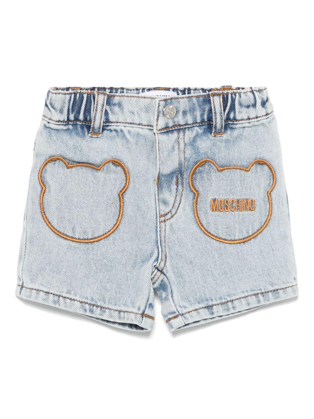 Pantaloncini con logo ricamato per neonata Moschino Kids azzurro con passanti per cintura - Rubino Kids