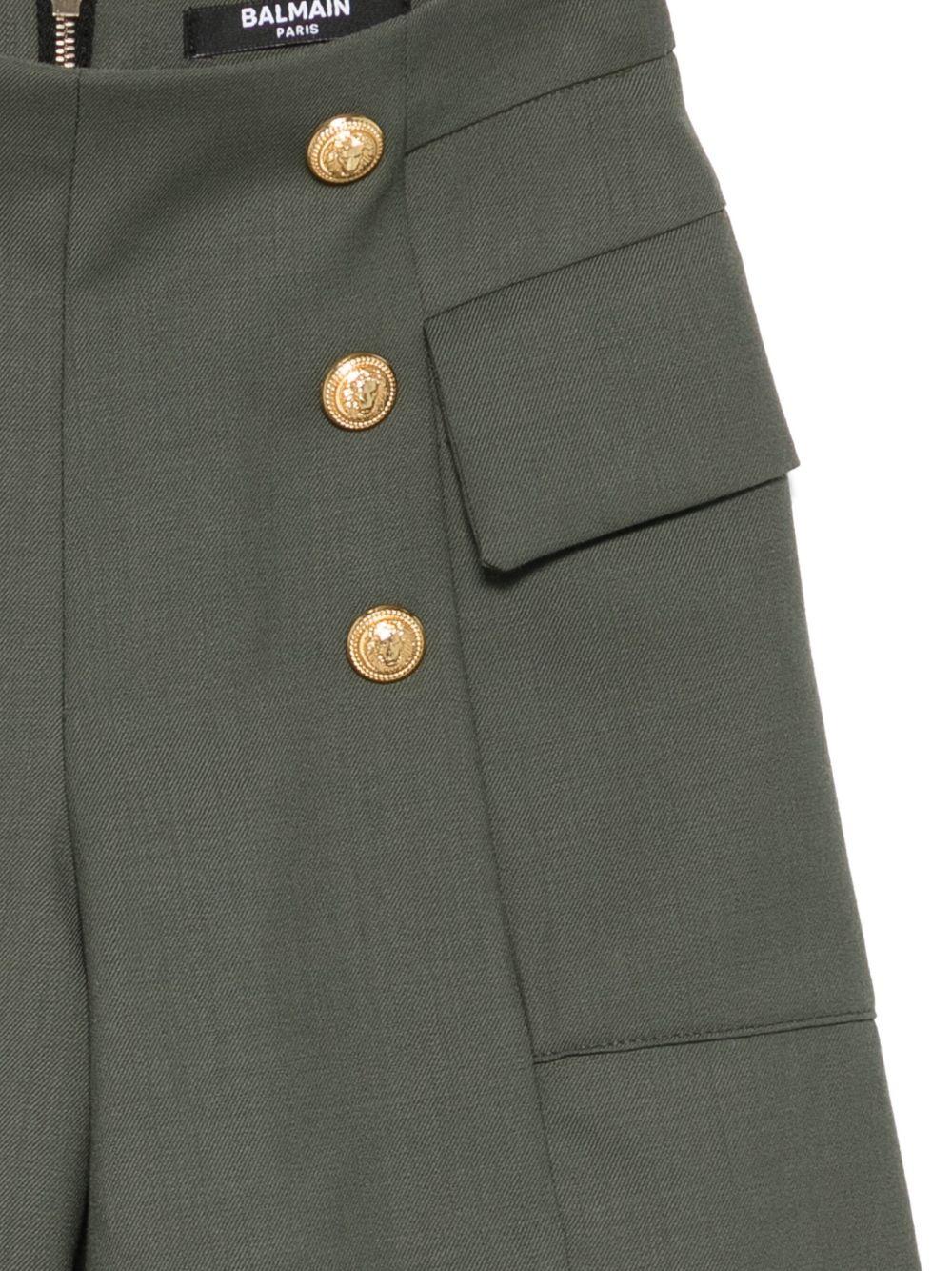 Pantaloncini per bambina Balmain Kids verde con tasche e bottoni - Rubino Kids