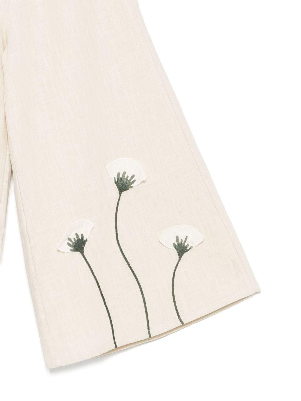 Pantaloni per bambina Donsje beige con applicazione a fiori - Rubino Kids