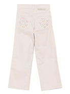 Pantaloni per bambina Stella McCartney Kids beige con stampa con cuori - Rubino Kids