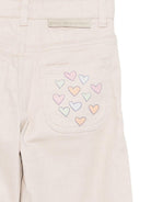 Pantaloni per bambina Stella McCartney Kids beige con stampa con cuori - Rubino Kids