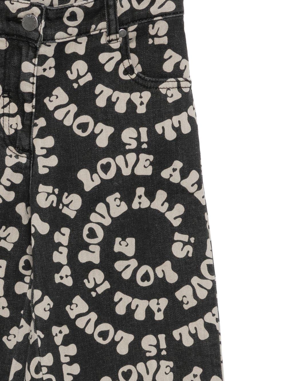 Pantaloni per bambina Stella McCartney Kids nero stampati Love is All - Rubino Kids
