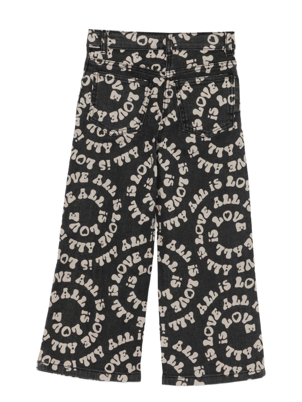 Pantaloni per bambina Stella McCartney Kids nero stampati Love is All - Rubino Kids