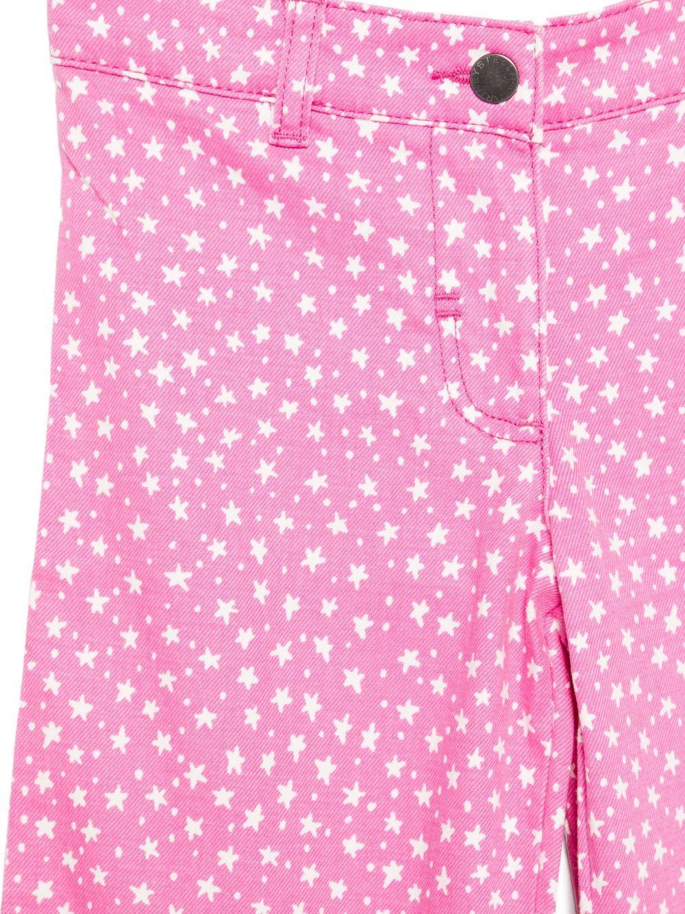 Pantaloni per bambina Stella McCartney Kids rosa con stampa stelle all - over - Rubino Kids