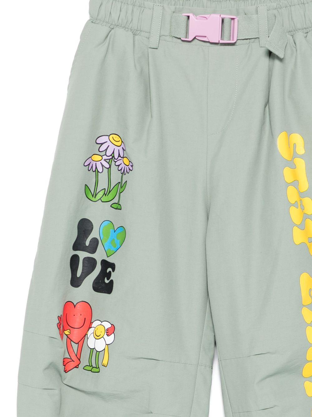 Pantaloni per bambina Stella McCartney Kids verde con stampa grafica - Rubino Kids