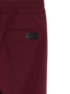 Pantaloni per bambini MSGM Kids bordeaux con elastico in vita e orli svasati - Rubino Kids