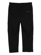 Pantaloni per bambini MSGM Kids neri con elastico in vita e orli svasati - Rubino Kids