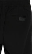 Pantaloni per bambini MSGM Kids neri con elastico in vita e orli svasati - Rubino Kids