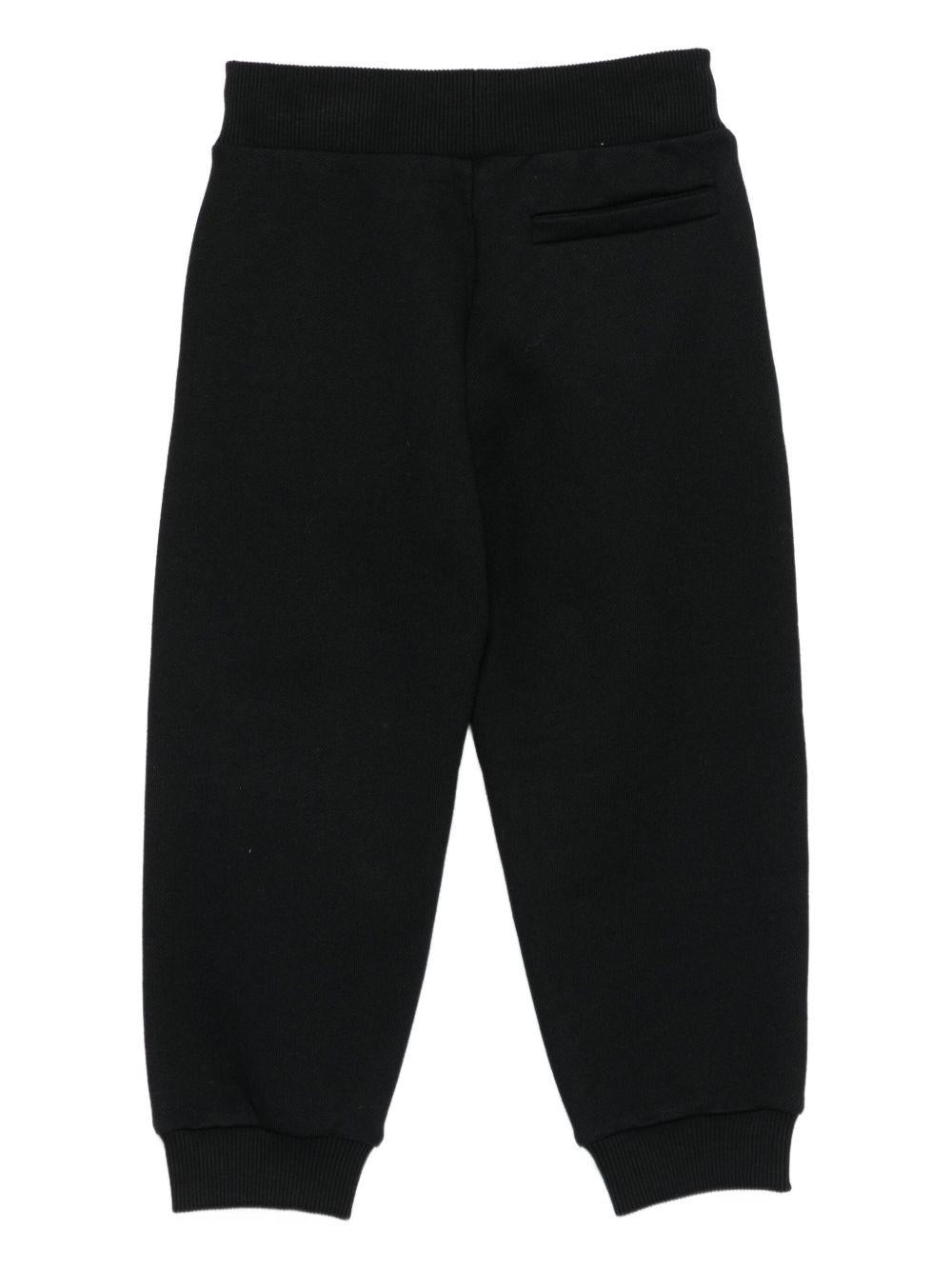 Pantaloni per bambino Balmain Kids nero con polsini elasticizzati - Rubino Kids