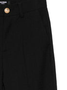 Pantaloni per bambino Balmain Kids nero in lana vergine - Rubino Kids