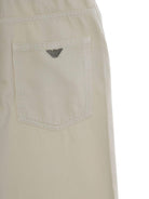 Pantaloni per bambino Emporio Armani Kids beige con tasche applicate - Rubino Kids