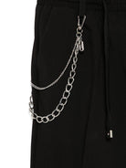 Pantaloni per bambino John Richmond Junior nero con applicazione logo - Rubino Kids