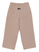 Pantaloni per bambino MSGM Kids beige con stampa logo - Rubino Kids