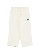 Pantaloni per bambino MSGM Kids bianchi con stampa del logo - Rubino Kids
