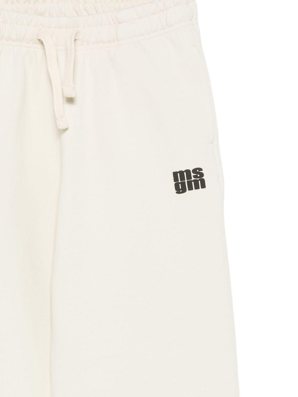 Pantaloni per bambino MSGM Kids bianchi con stampa del logo - Rubino Kids
