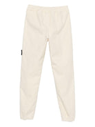 Pantaloni per bambino Stone Island Junior bianchi con applicazione con logo - Rubino Kids