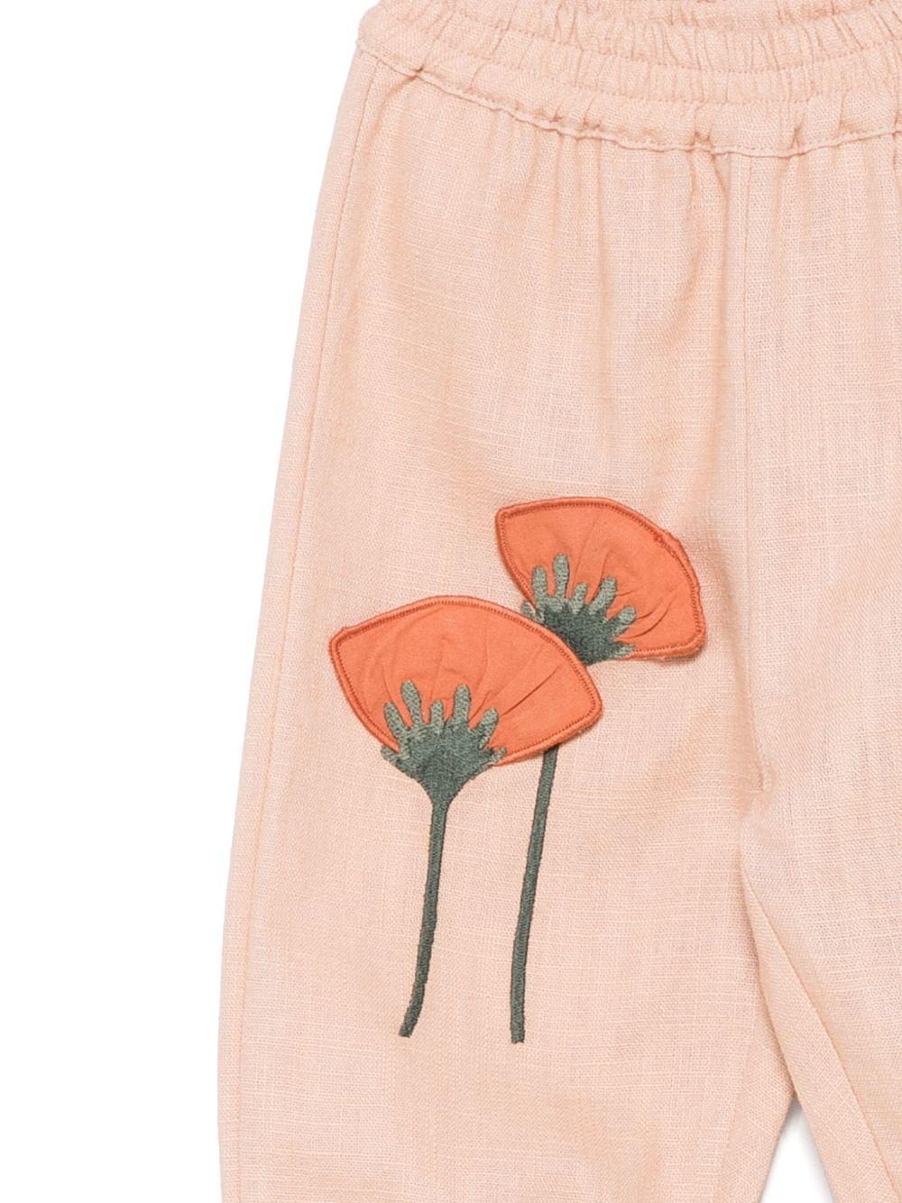 Pantaloni per neonata Donsje Anje rosa con applicazione a fiori - Rubino Kids