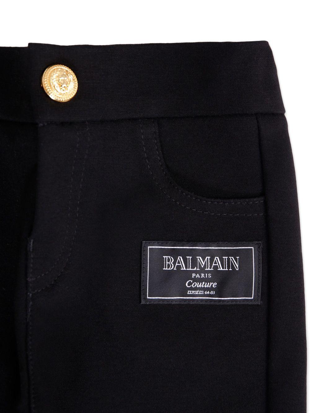 Pantaloni per neonato Balmain Kids neri con applicazione con logo e vita elasticizzata - Rubino Kids