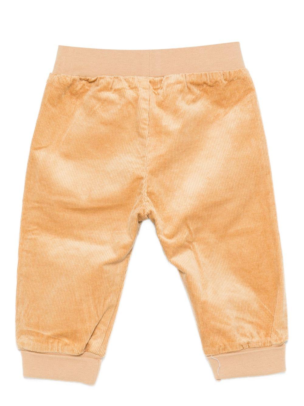 Pantaloni per neonato Moschino Kids beige di velluto a coste con ricami a forma di orsacchiotto - Rubino Kids