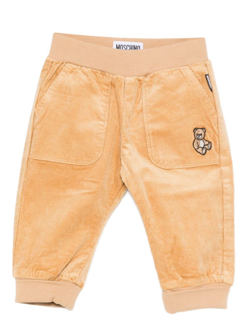 Pantaloni per neonato Moschino Kids beige di velluto a coste con ricami a forma di orsacchiotto - Rubino Kids