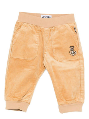Pantaloni per neonato Moschino Kids beige di velluto a coste con ricami a forma di orsacchiotto