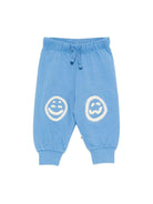 Pantaloni Simeon sportivi per neonato Molo azzurri con toppe smile sulle ginocchia - Rubino Kids