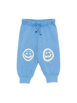 Pantaloni Simeon sportivi per neonato Molo azzurri con toppe smile sulle ginocchia
