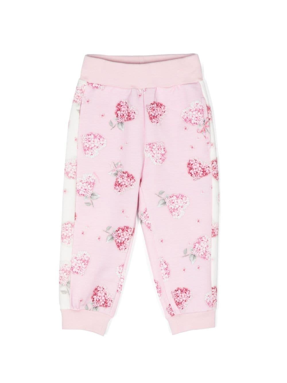 Pantaloni sportivi a fiori per neonata Monnalisa rosa con gamba affusolata - Rubino Kids